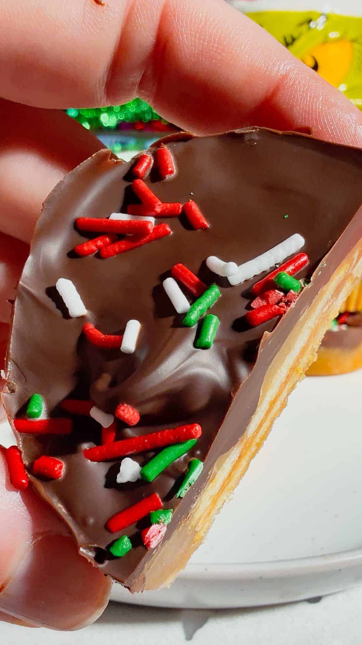 Get ready for the ultimate sweet-and-salty holiday treat with these Peanut Butter Ritz Crack Christmas Crack Cookies! Made in muffin tins, this fun twist on classic Christmas crack uses Peanut Butter Ritz Cracker Snackwiches smothered in rich, buttery toffee, topped with melted semi-sweet chocolate, and finished with festive sprinkles. Easy to make, irresistibly crunchy, and perfectly portioned, these holiday cookies are guaranteed to disappear fast at parties, on cookie trays, or as edible gifts.