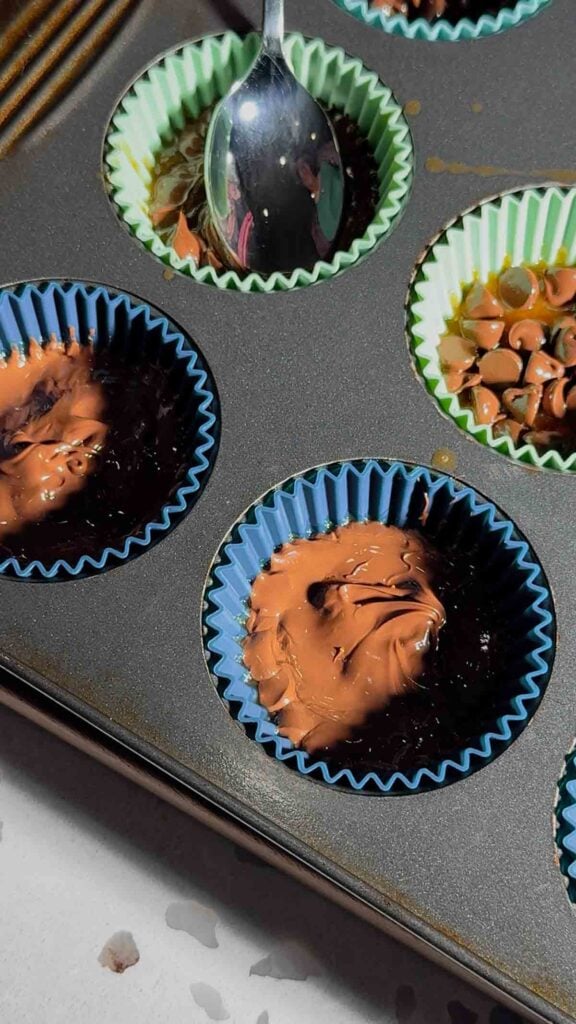 melted chocolate spread over ritz cracker christmas crack in muffin cups