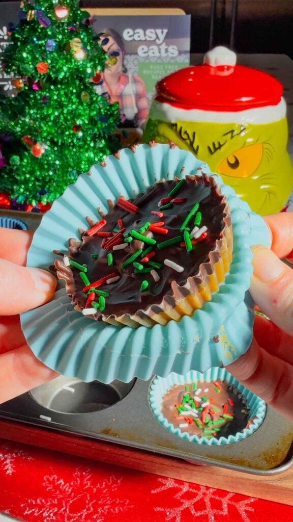 Get ready for the ultimate sweet-and-salty holiday treat with these Peanut Butter Ritz Crack Christmas Crack Cookies! Made in muffin tins, this fun twist on classic Christmas crack uses Peanut Butter Ritz Cracker Snackwiches smothered in rich, buttery toffee, topped with melted semi-sweet chocolate, and finished with festive sprinkles. Easy to make, irresistibly crunchy, and perfectly portioned, these holiday cookies are guaranteed to disappear fast at parties, on cookie trays, or as edible gifts.