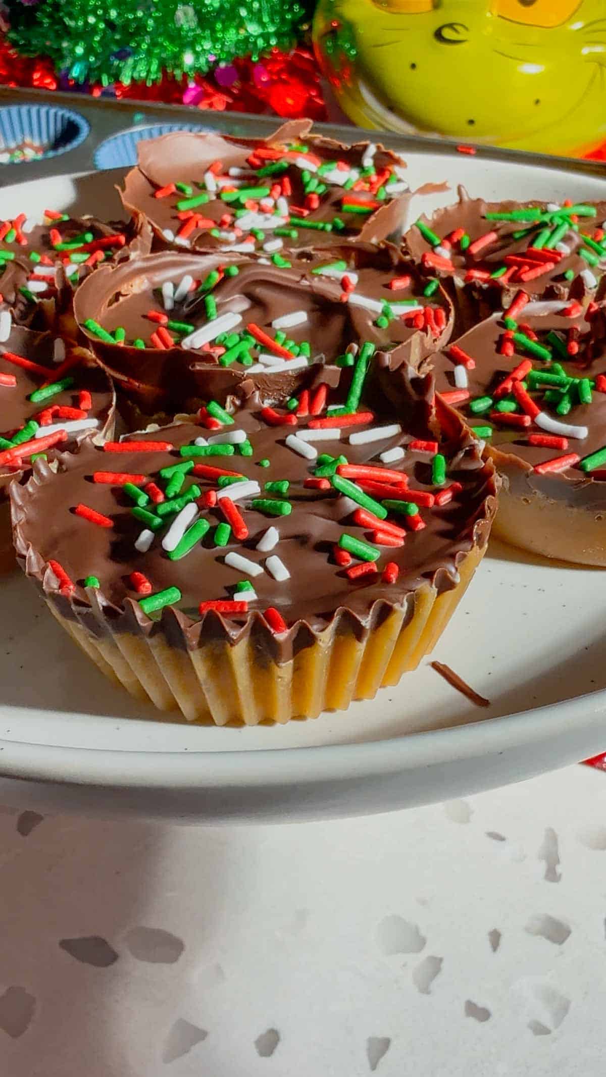 Get ready for the ultimate sweet-and-salty holiday treat with these Peanut Butter Ritz Crack Christmas Crack Cookies! Made in muffin tins, this fun twist on classic Christmas crack uses Peanut Butter Ritz Cracker Snackwiches smothered in rich, buttery toffee, topped with melted semi-sweet chocolate, and finished with festive sprinkles. Easy to make, irresistibly crunchy, and perfectly portioned, these holiday cookies are guaranteed to disappear fast at parties, on cookie trays, or as edible gifts.