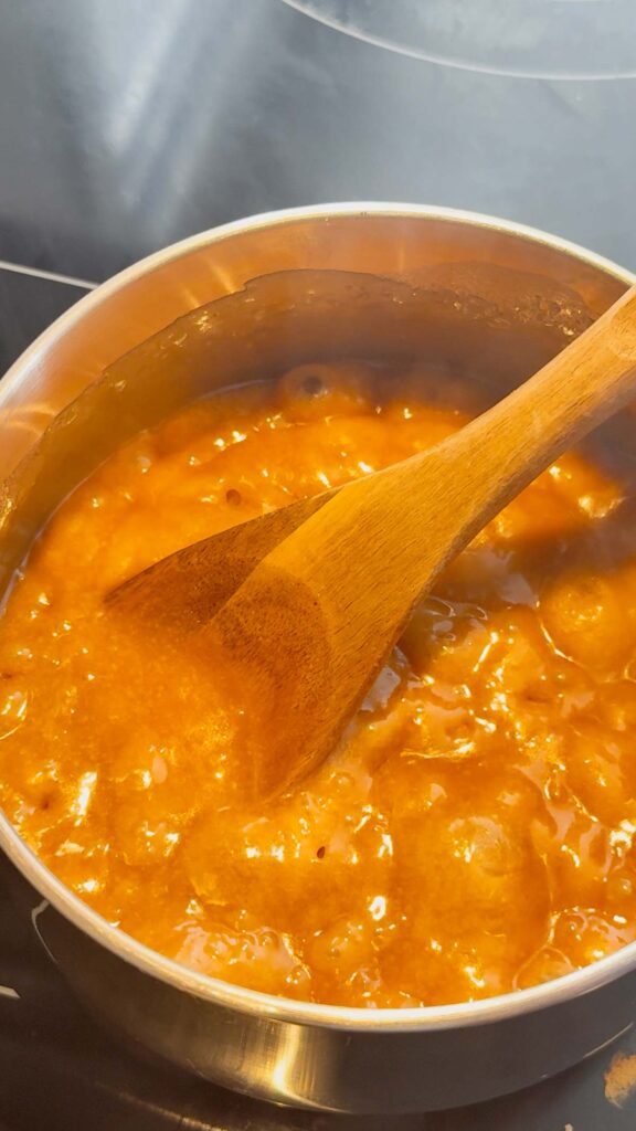 butter and brown sugar toffee mixture bubbling in a saucepan