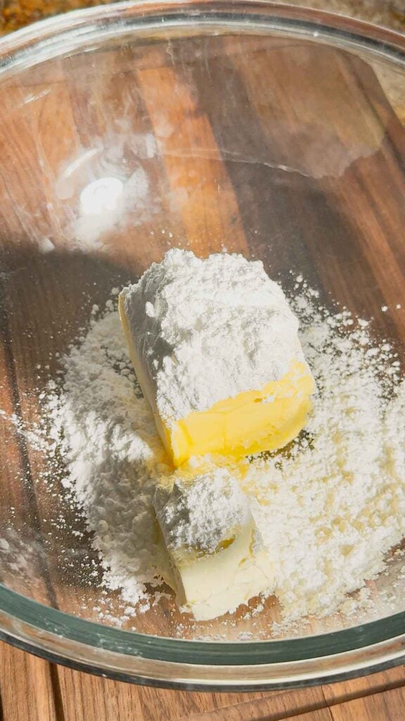 butter, cream cheese and powdered sugar in a mixing bowl