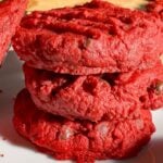 These red velvet shortbread cookies are a festive twist on classic whipped shortbread, with a rich red colour. With cream cheese, a hint of cocoa powder, and mini chocolate chips, this easy red velvet cookie recipe delivers the perfect balance of buttery, chocolatey flavour in every bite. Whether you’re baking for the holidays, a cookie exchange, or just because, these red velvet shortbread cookies are simple to make and guaranteed to stand out on any dessert table.