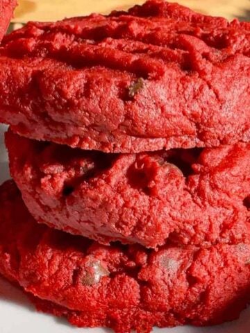 These red velvet shortbread cookies are a festive twist on classic whipped shortbread, with a rich red colour. With cream cheese, a hint of cocoa powder, and mini chocolate chips, this easy red velvet cookie recipe delivers the perfect balance of buttery, chocolatey flavour in every bite. Whether you’re baking for the holidays, a cookie exchange, or just because, these red velvet shortbread cookies are simple to make and guaranteed to stand out on any dessert table.