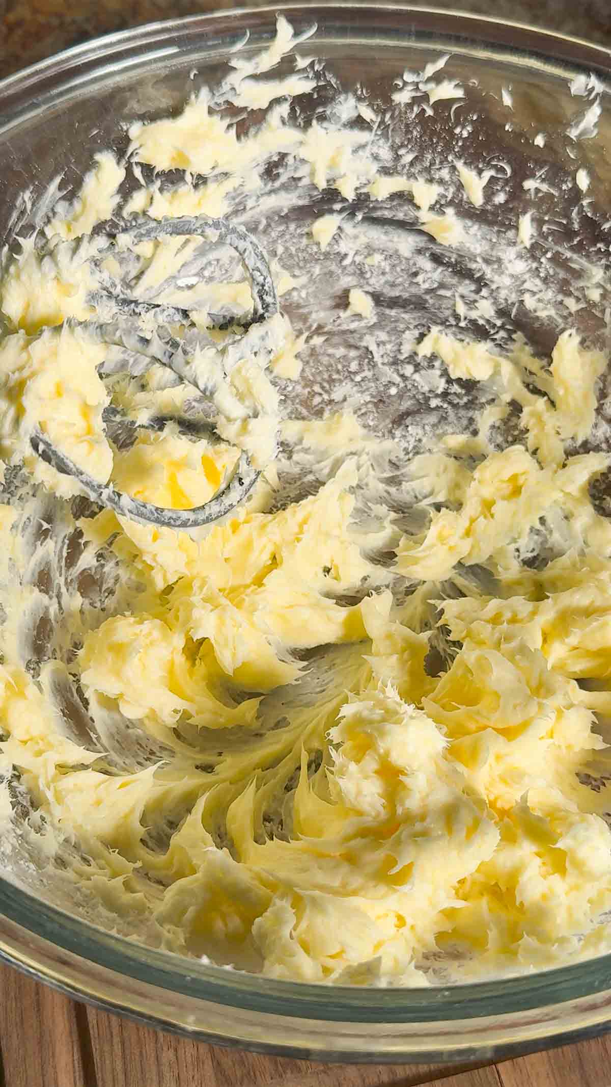 creamed butter, powdered sugar and cream cheese in a mixing bowl