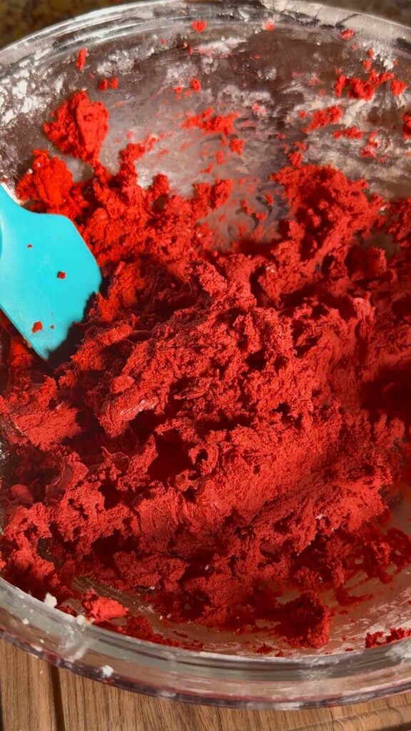 red velvet cookie dough in a mixing bowl