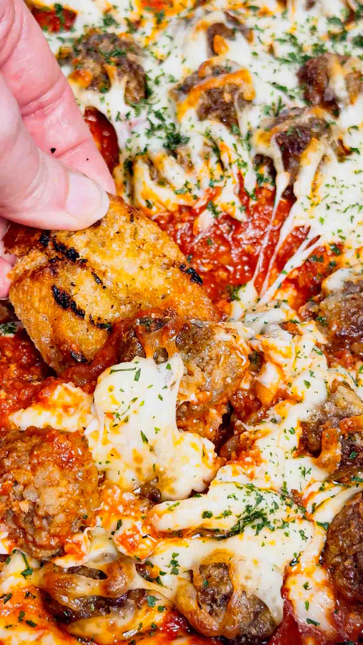 This Meatball Sub Dip is everything you love about a classic meatball sub, baked into a hot, cheesy skillet dip that’s perfect for sharing. Loaded with homemade tiny meatballs, creamy ricotta, rich pasta sauce, and plenty of shredded mozzarella, this easy baked dip comes out bubbly, melty, and packed with hearty Italian flavor. Serve it with sliced, toasted baguette for dipping to make every bite taste just like a warm, cheesy meatball sub—perfect for game day, parties, or any casual get-together.