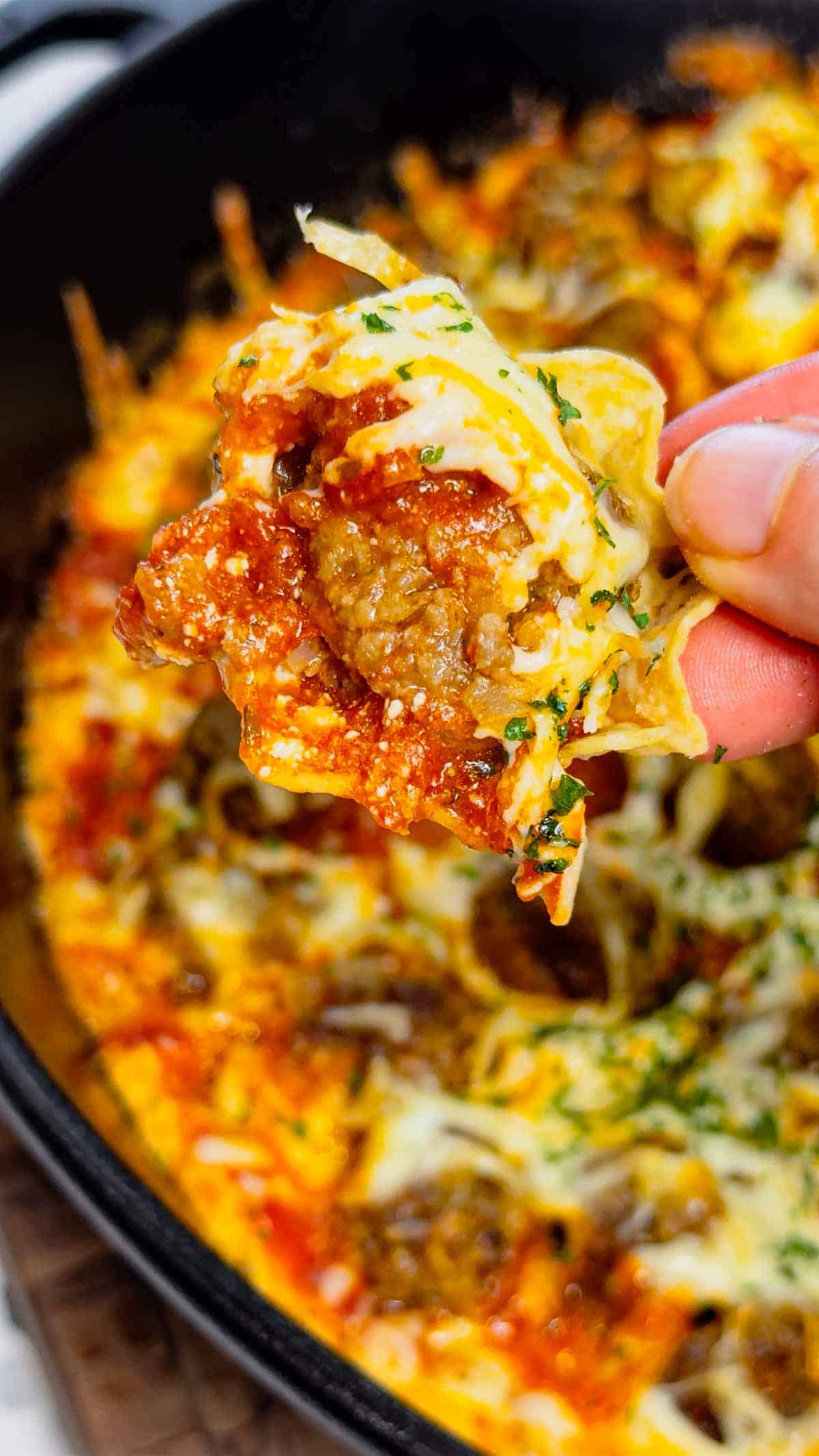 This Meatball Sub Dip is everything you love about a classic meatball sub, baked into a hot, cheesy skillet dip that’s perfect for sharing. Loaded with homemade tiny meatballs, creamy ricotta, rich pasta sauce, and plenty of shredded mozzarella, this easy baked dip comes out bubbly, melty, and packed with hearty Italian flavor. Serve it with sliced, toasted baguette for dipping to make every bite taste just like a warm, cheesy meatball sub—perfect for game day, parties, or any casual get-together.