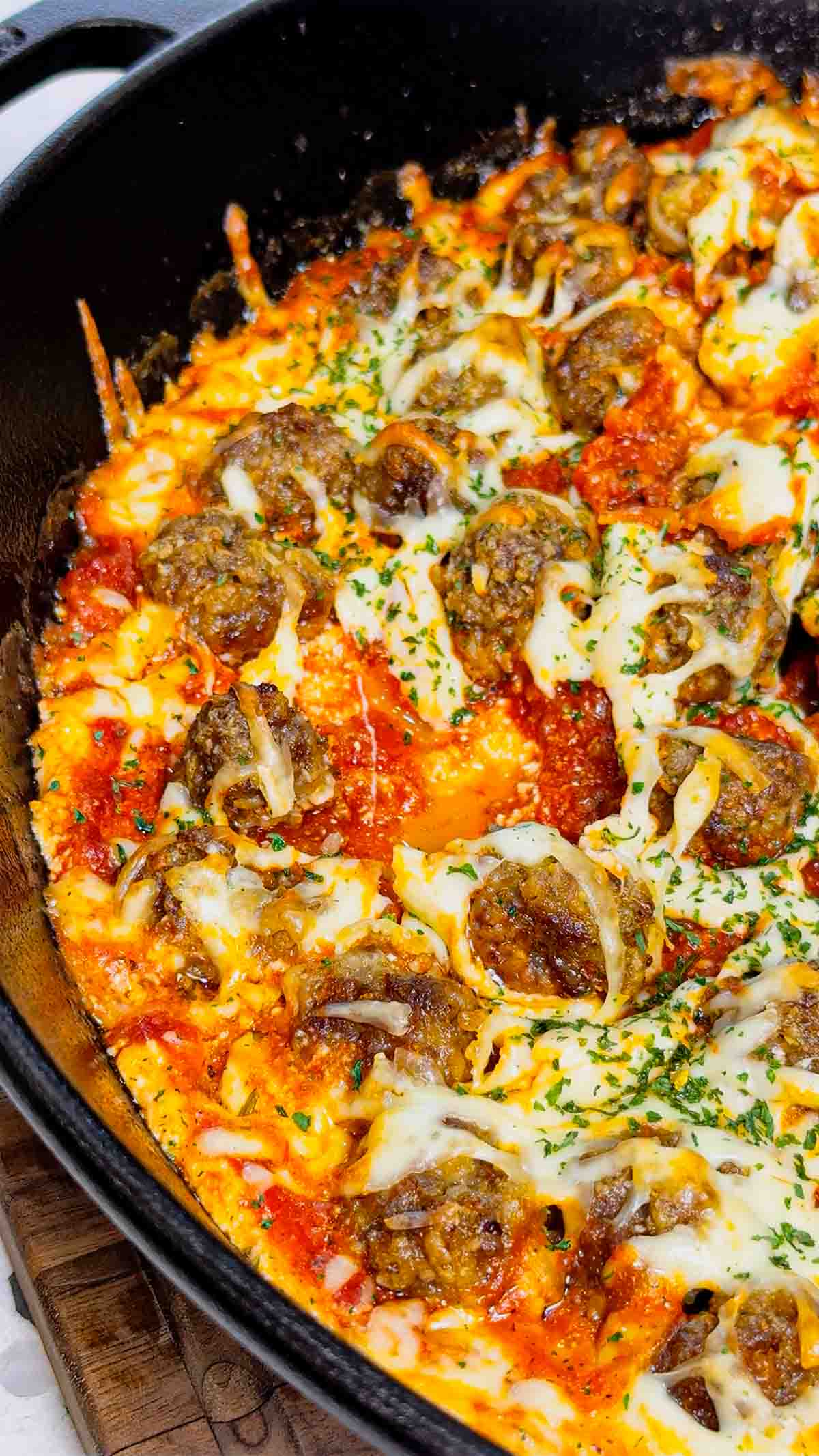 This Meatball Sub Dip is everything you love about a classic meatball sub, baked into a hot, cheesy skillet dip that’s perfect for sharing. Loaded with homemade tiny meatballs, creamy ricotta, rich pasta sauce, and plenty of shredded mozzarella, this easy baked dip comes out bubbly, melty, and packed with hearty Italian flavor. Serve it with sliced, toasted baguette for dipping to make every bite taste just like a warm, cheesy meatball sub—perfect for game day, parties, or any casual get-together.