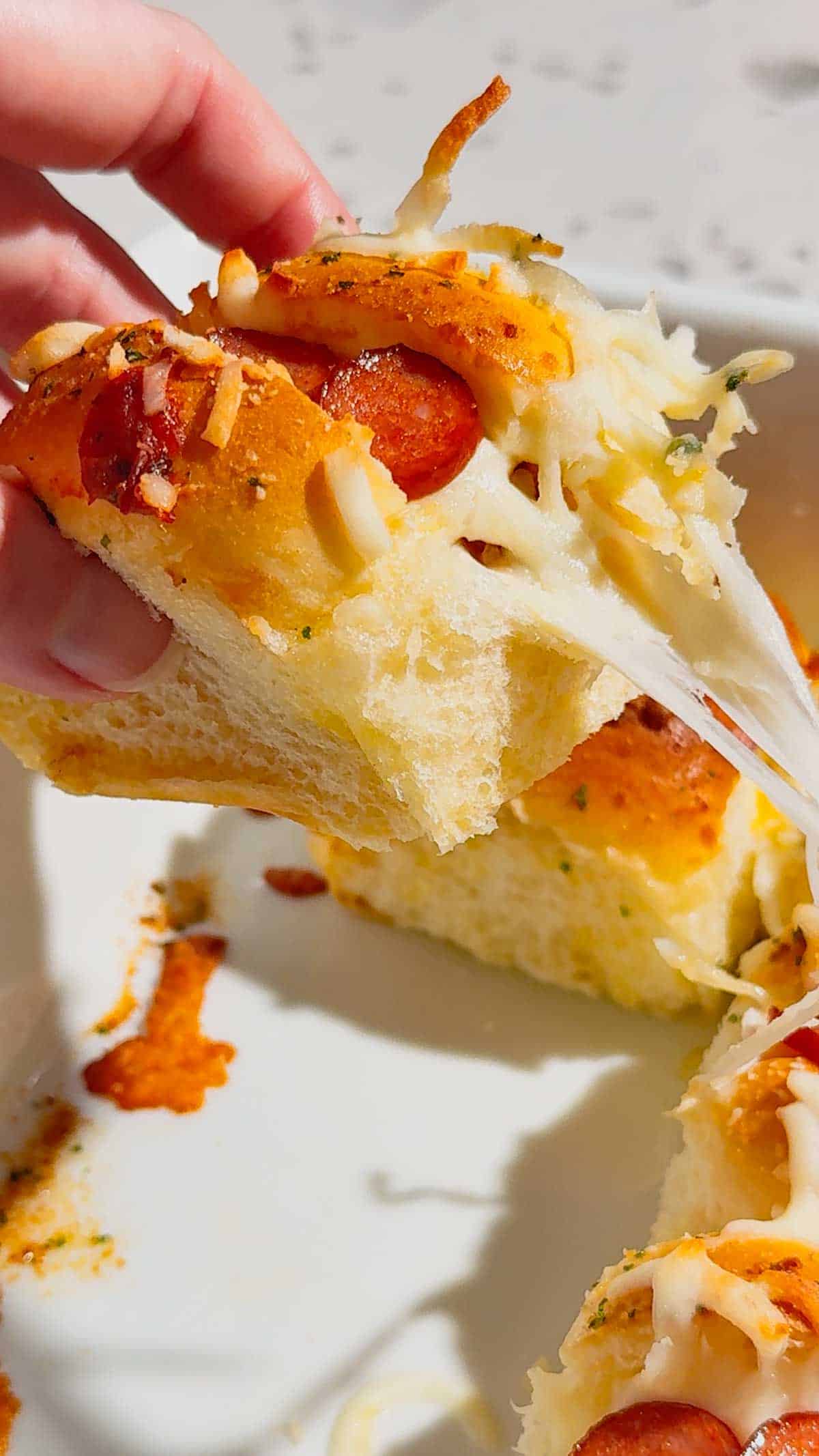 Craving fun, bite-sized party food? These Mini Pizza Dog Sliders are the ultimate crowd-pleaser! King's Hawaiian rolls brushed with garlic butter, stuffed with cocktail wieners, topped with tangy pizza sauce, heaps of shredded mozzarella & mini pepperoni slices—baked 18 minutes at 350°F until golden, toasty & bubbly! Ready in 30 minutes total (12 min prep), makes 12 mini hot dog sliders. Perfect game day snack, kid-friendly appetizer, easy party food, Super Bowl treat or quick family dinner. So cheesy, so fun! 🍕🌭🥖 #MiniPizzaDogs #PizzaDogSliders #CocktailWeinerSliders #KingHawaiianRecipes #EasyAppetizers #GameDayFood #PartyFoodIdeas #MiniHotDogs #CheesySliders #QuickSnacks #KidFriendlyRecipes #BakedSliders