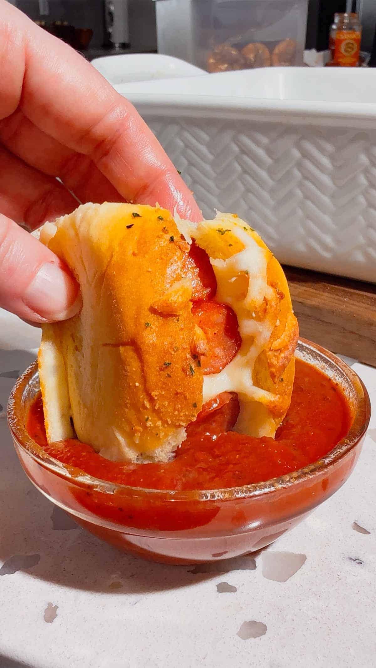 Craving fun, bite-sized party food? These Mini Pizza Dog Sliders are the ultimate crowd-pleaser! King's Hawaiian rolls brushed with garlic butter, stuffed with cocktail wieners, topped with tangy pizza sauce, heaps of shredded mozzarella & mini pepperoni slices—baked 18 minutes at 350°F until golden, toasty & bubbly! Ready in 30 minutes total (12 min prep), makes 12 mini hot dog sliders. Perfect game day snack, kid-friendly appetizer, easy party food, Super Bowl treat or quick family dinner. So cheesy, so fun! 🍕🌭🥖 #MiniPizzaDogs #PizzaDogSliders #CocktailWeinerSliders #KingHawaiianRecipes #EasyAppetizers #GameDayFood #PartyFoodIdeas #MiniHotDogs #CheesySliders #QuickSnacks #KidFriendlyRecipes #BakedSliders