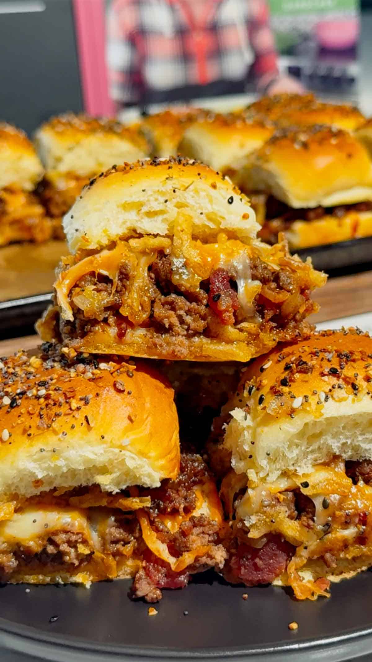 BBQ Bacon Cheeseburger Sliders are the ultimate easy dinner or party food! Juicy ground beef, diced onions, crumbled bacon, and BBQ sauce piled onto buttery King’s Hawaiian rolls, topped with shredded cheddar, crispy fried onions, and everything bagel seasoning. Perfect for game day, potlucks, weeknight dinners, or crowd-pleasing appetizers. Save this cheesy slider recipe! 🍔🔥