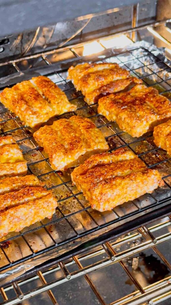 mcrib patties on a baking sheet in the oven