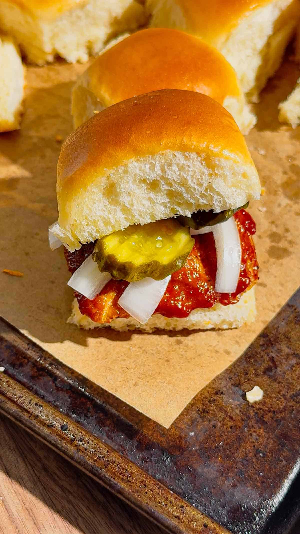 These homemade McRib sliders are the ultimate easy dinner idea for busy weeknights, game day snacks or party food! Made with soft King&rsquo;s Hawaiian rolls brushed with butter and toasted to perfection, these BBQ pork sliders are loaded with juicy ground pork patties seasoned with bold barbecue flavour and coated in Sweet Baby Ray&rsquo;s sauce. Topped with sliced pickles and onions, they deliver that classic McRib taste in a fun, shareable slider recipe. If you&rsquo;re looking for easy slider recipes, Hawaiian roll sliders, BBQ pork recipes or crowd-pleasing comfort food ideas, this simple recipe is a must-try. Perfect for family dinners, picky eaters and quick meals everyone will love!