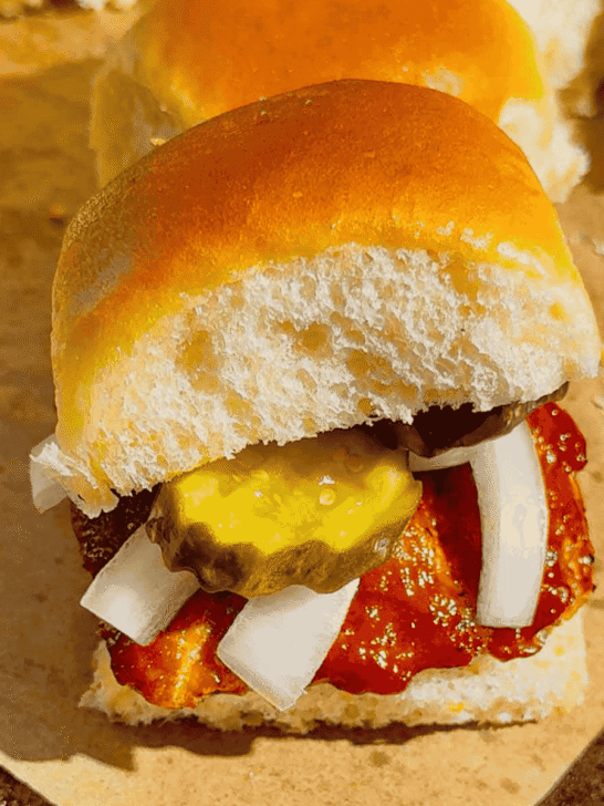 These homemade McRib sliders are the ultimate easy dinner idea for busy weeknights, game day snacks or party food! Made with soft King’s Hawaiian rolls brushed with butter and toasted to perfection, these BBQ pork sliders are loaded with juicy ground pork patties seasoned with bold barbecue flavour and coated in Sweet Baby Ray’s sauce. Topped with sliced pickles and onions, they deliver that classic McRib taste in a fun, shareable slider recipe. If you’re looking for easy slider recipes, Hawaiian roll sliders, BBQ pork recipes or crowd-pleasing comfort food ideas, this simple recipe is a must-try. Perfect for family dinners, picky eaters and quick meals everyone will love!