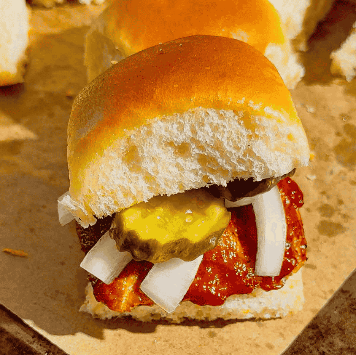 These homemade McRib sliders are the ultimate easy dinner idea for busy weeknights, game day snacks or party food! Made with soft King’s Hawaiian rolls brushed with butter and toasted to perfection, these BBQ pork sliders are loaded with juicy ground pork patties seasoned with bold barbecue flavour and coated in Sweet Baby Ray’s sauce. Topped with sliced pickles and onions, they deliver that classic McRib taste in a fun, shareable slider recipe. If you’re looking for easy slider recipes, Hawaiian roll sliders, BBQ pork recipes or crowd-pleasing comfort food ideas, this simple recipe is a must-try. Perfect for family dinners, picky eaters and quick meals everyone will love!