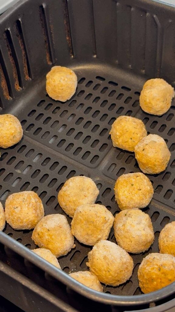 frozen meatballs in an air fryer basket