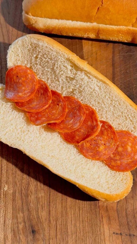 pepperoni slices on a hot dog bun