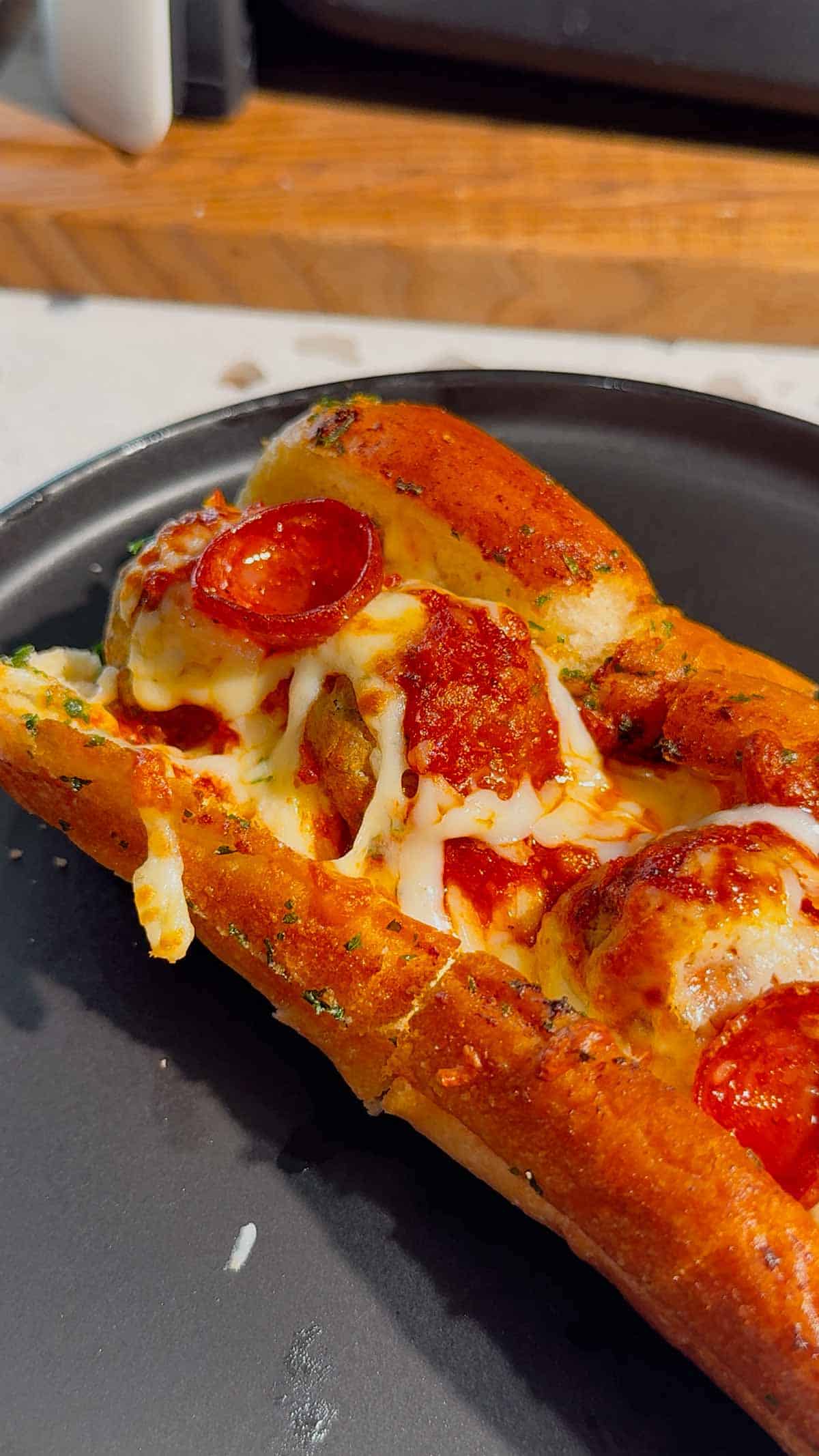 These Air Fryer Pizza Meatball Subs are the ultimate easy comfort food dinner for busy weeknights, game day snacks and picky eaters. Made with frozen meatballs, pizza sauce, pepperoni, mozzarella cheese and buttery toasted hot dog buns, this easy air fryer recipe tastes just like a cheesy pepperoni pizza sub from your favourite restaurant. Perfect for quick family dinners, easy air fryer meals, meatball sandwich recipes, pizza sandwich ideas and kid friendly dinners, these toasted subs come together fast with minimal prep. If you are looking for easy dinner recipes for family, air fryer sandwich recipes, hot sandwich ideas, meatball sub recipes or fun weeknight dinner ideas, these crispy cheesy pizza subs are always a hit.