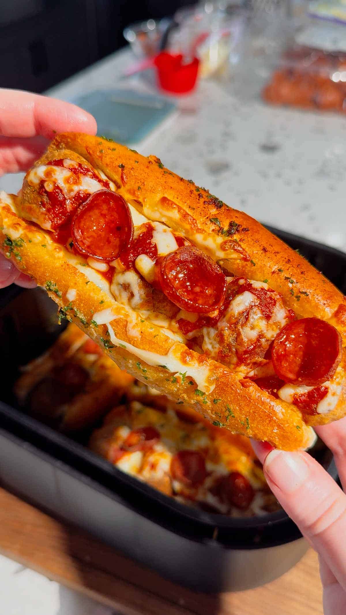 These Air Fryer Pizza Meatball Subs are the ultimate easy comfort food dinner for busy weeknights, game day snacks and picky eaters. Made with frozen meatballs, pizza sauce, pepperoni, mozzarella cheese and buttery toasted hot dog buns, this easy air fryer recipe tastes just like a cheesy pepperoni pizza sub from your favourite restaurant. Perfect for quick family dinners, easy air fryer meals, meatball sandwich recipes, pizza sandwich ideas and kid friendly dinners, these toasted subs come together fast with minimal prep. If you are looking for easy dinner recipes for family, air fryer sandwich recipes, hot sandwich ideas, meatball sub recipes or fun weeknight dinner ideas, these crispy cheesy pizza subs are always a hit.