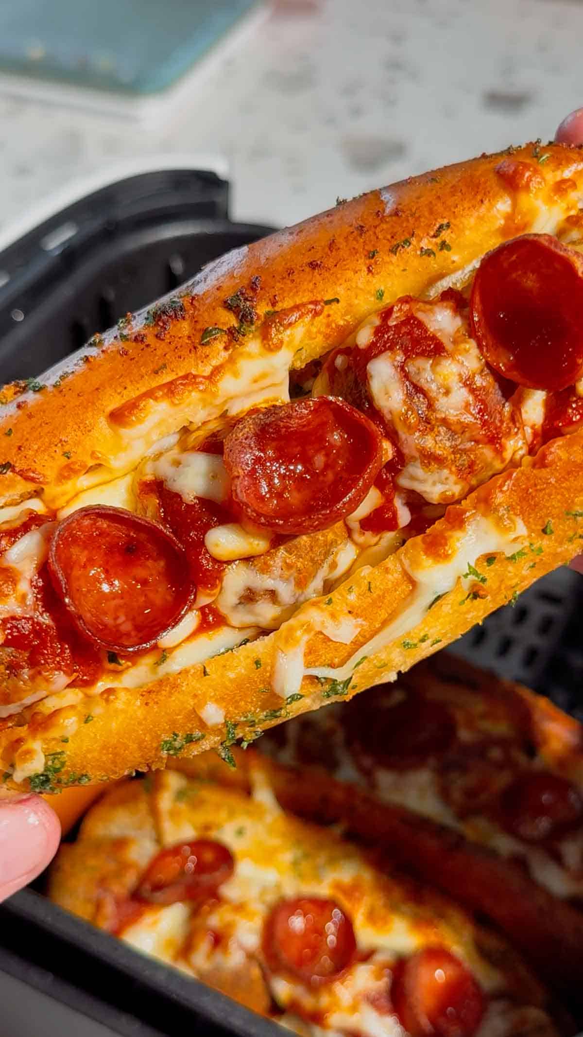 These Air Fryer Pizza Meatball Subs are the ultimate easy comfort food dinner for busy weeknights, game day snacks and picky eaters. Made with frozen meatballs, pizza sauce, pepperoni, mozzarella cheese and buttery toasted hot dog buns, this easy air fryer recipe tastes just like a cheesy pepperoni pizza sub from your favourite restaurant. Perfect for quick family dinners, easy air fryer meals, meatball sandwich recipes, pizza sandwich ideas and kid friendly dinners, these toasted subs come together fast with minimal prep. If you are looking for easy dinner recipes for family, air fryer sandwich recipes, hot sandwich ideas, meatball sub recipes or fun weeknight dinner ideas, these crispy cheesy pizza subs are always a hit.