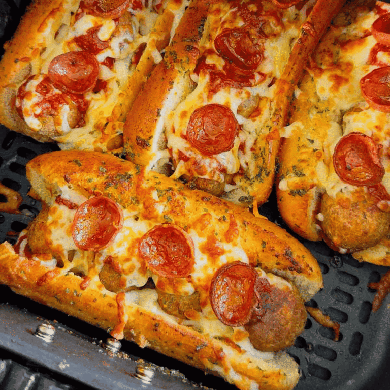 These Air Fryer Pizza Meatball Subs are the ultimate easy comfort food dinner for busy weeknights, game day snacks and picky eaters. Made with frozen meatballs, pizza sauce, pepperoni, mozzarella cheese and buttery toasted hot dog buns, this easy air fryer recipe tastes just like a cheesy pepperoni pizza sub from your favourite restaurant. Perfect for quick family dinners, easy air fryer meals, meatball sandwich recipes, pizza sandwich ideas and kid friendly dinners, these toasted subs come together fast with minimal prep. If you are looking for easy dinner recipes for family, air fryer sandwich recipes, hot sandwich ideas, meatball sub recipes or fun weeknight dinner ideas, these crispy cheesy pizza subs are always a hit.