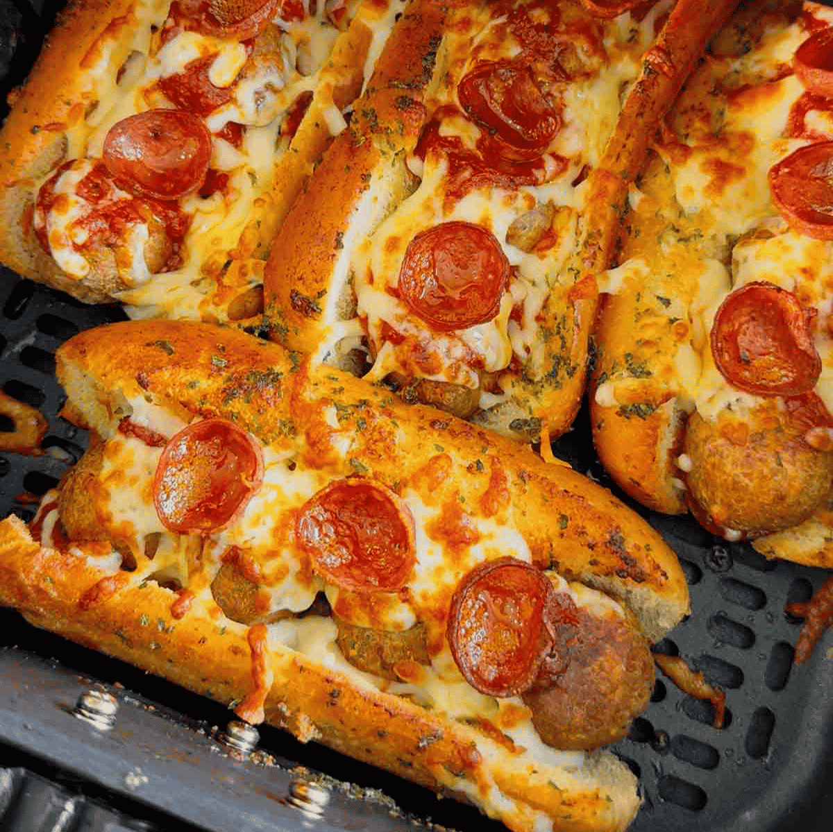 These Air Fryer Pizza Meatball Subs are the ultimate easy comfort food dinner for busy weeknights, game day snacks and picky eaters. Made with frozen meatballs, pizza sauce, pepperoni, mozzarella cheese and buttery toasted hot dog buns, this easy air fryer recipe tastes just like a cheesy pepperoni pizza sub from your favourite restaurant. Perfect for quick family dinners, easy air fryer meals, meatball sandwich recipes, pizza sandwich ideas and kid friendly dinners, these toasted subs come together fast with minimal prep. If you are looking for easy dinner recipes for family, air fryer sandwich recipes, hot sandwich ideas, meatball sub recipes or fun weeknight dinner ideas, these crispy cheesy pizza subs are always a hit.