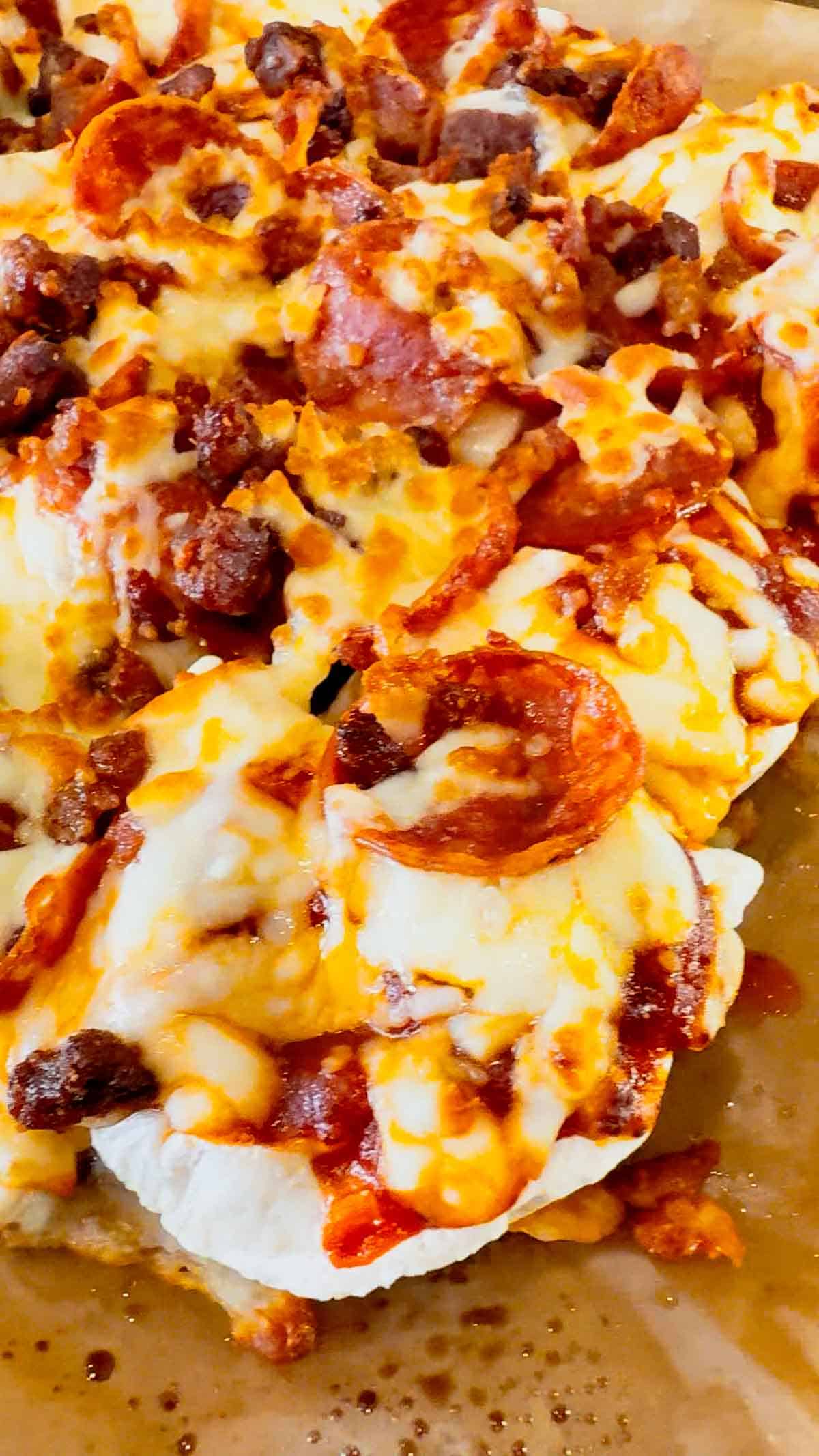 Air Fryer Pizza Pierogies are the ultimate easy comfort food recipe for busy weeknights, game day snacks, party appetizers and lazy dinners. Frozen bacon pierogies are air fried until crispy and golden, then topped with pizza sauce, shredded mozzarella cheese, pepperoni and crumbled bacon for a cheesy pizza-inspired dinner everyone will love. This easy air fryer recipe is perfect for picky eaters, quick meals, easy dinner ideas, air fryer snacks and fun family dinners. If you love pizza recipes, frozen pierogi recipes, cheesy appetizers, easy air fryer dinners, quick comfort food and crispy air fryer recipes, these loaded pizza pierogies are a must-try for your next weeknight meal, movie night snack or game day party food spread.