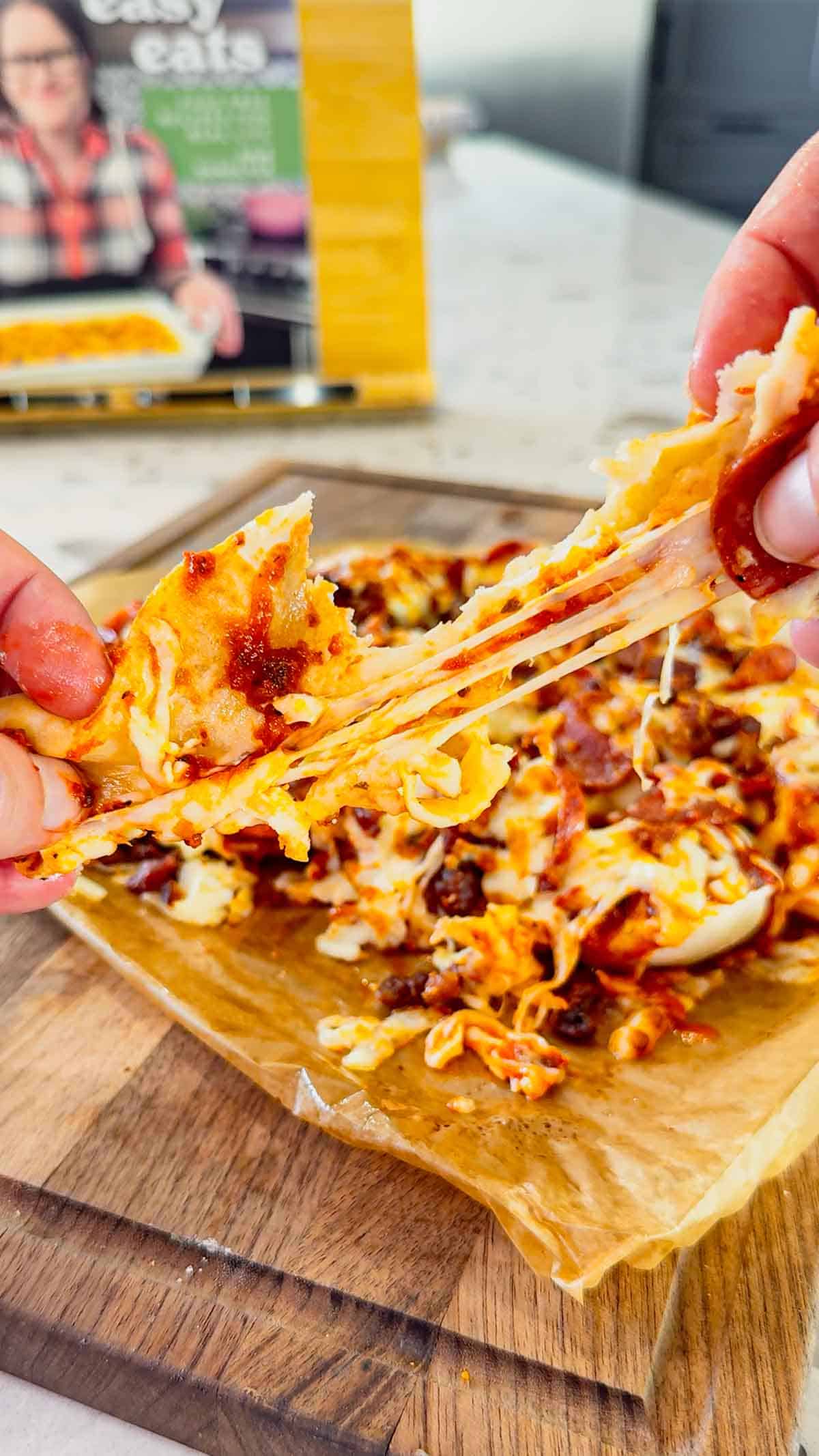 Air Fryer Pizza Pierogies are the ultimate easy comfort food recipe for busy weeknights, game day snacks, party appetizers and lazy dinners. Frozen bacon pierogies are air fried until crispy and golden, then topped with pizza sauce, shredded mozzarella cheese, pepperoni and crumbled bacon for a cheesy pizza-inspired dinner everyone will love. This easy air fryer recipe is perfect for picky eaters, quick meals, easy dinner ideas, air fryer snacks and fun family dinners. If you love pizza recipes, frozen pierogi recipes, cheesy appetizers, easy air fryer dinners, quick comfort food and crispy air fryer recipes, these loaded pizza pierogies are a must-try for your next weeknight meal, movie night snack or game day party food spread.