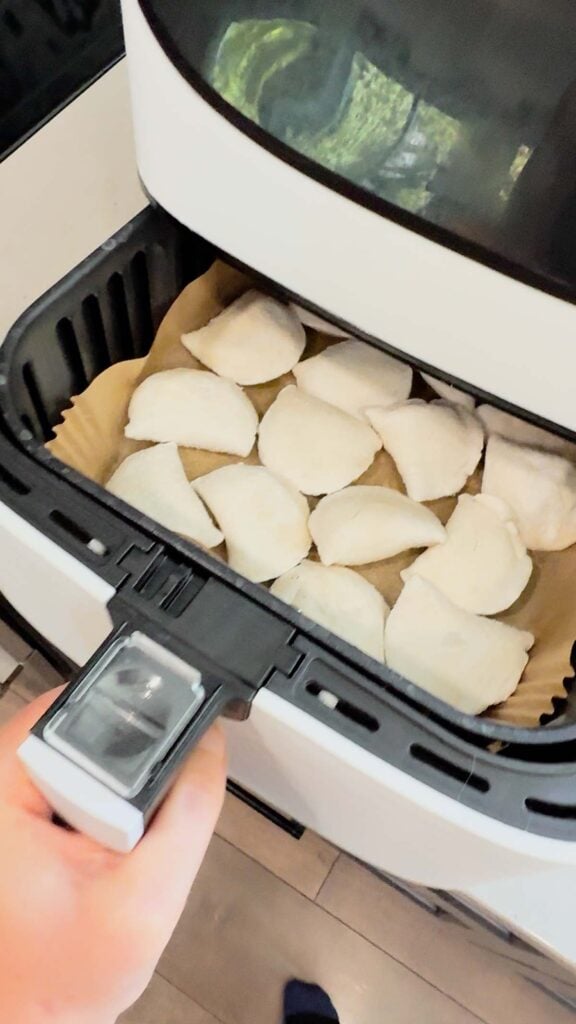 frozen pierogies in an air fryer basket