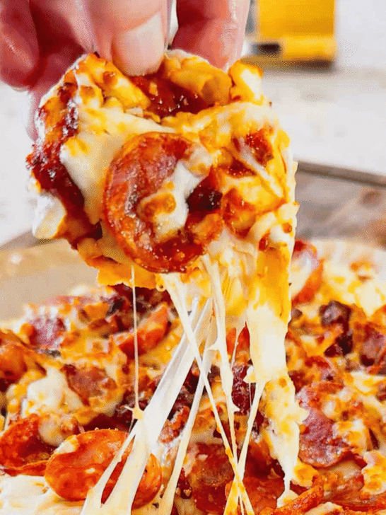 Air Fryer Pizza Pierogies are the ultimate easy comfort food recipe for busy weeknights, game day snacks, party appetizers and lazy dinners. Frozen bacon pierogies are air fried until crispy and golden, then topped with pizza sauce, shredded mozzarella cheese, pepperoni and crumbled bacon for a cheesy pizza-inspired dinner everyone will love. This easy air fryer recipe is perfect for picky eaters, quick meals, easy dinner ideas, air fryer snacks and fun family dinners. If you love pizza recipes, frozen pierogi recipes, cheesy appetizers, easy air fryer dinners, quick comfort food and crispy air fryer recipes, these loaded pizza pierogies are a must-try for your next weeknight meal, movie night snack or game day party food spread.