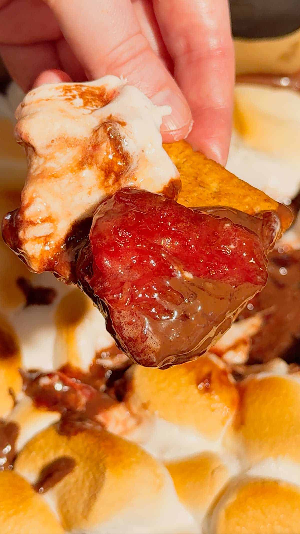 This Air Fryer Strawberry Nutella S’mores Dip is the ultimate easy dessert recipe for chocolate lovers, summer parties and cozy movie nights at home. Made with creamy Nutella, sweet strawberry pie filling and gooey toasted marshmallows, this air fryer dessert is a fun twist on classic campfire s’mores without needing a fire pit. Serve it warm with graham crackers, cookies, pretzels or fresh strawberries for the perfect sweet snack, party dessert or quick treat idea. If you love easy air fryer recipes, dessert dips, viral TikTok desserts, chocolate strawberry desserts, marshmallow treats and fun family dessert ideas, this easy s’mores dip recipe is a must try for sleepovers, date nights, birthday parties, holiday gatherings and summer entertaining.