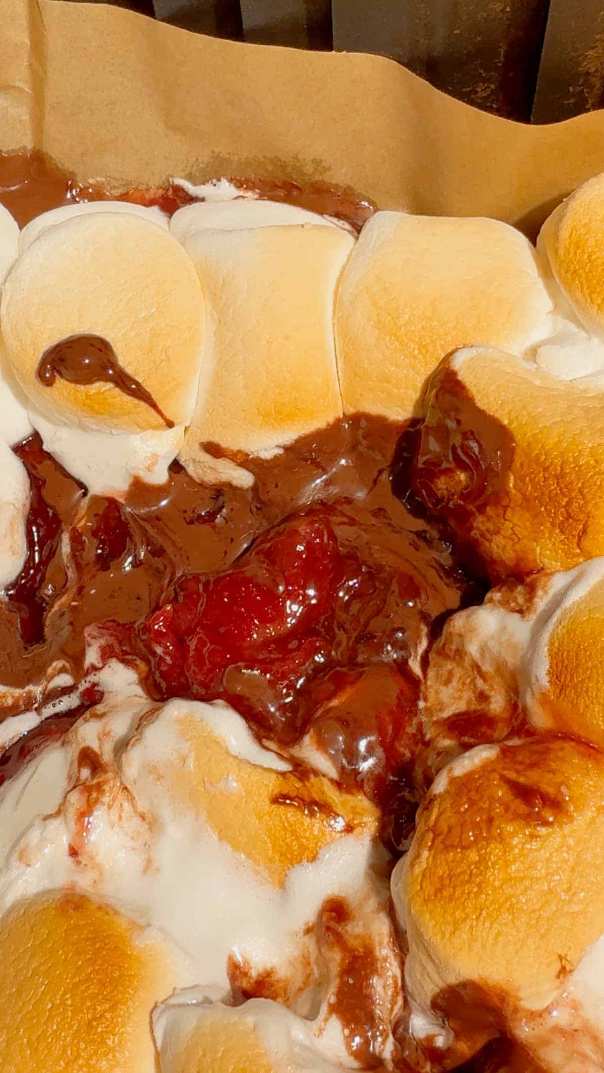 This Air Fryer Strawberry Nutella S’mores Dip is the ultimate easy dessert recipe for chocolate lovers, summer parties and cozy movie nights at home. Made with creamy Nutella, sweet strawberry pie filling and gooey toasted marshmallows, this air fryer dessert is a fun twist on classic campfire s’mores without needing a fire pit. Serve it warm with graham crackers, cookies, pretzels or fresh strawberries for the perfect sweet snack, party dessert or quick treat idea. If you love easy air fryer recipes, dessert dips, viral TikTok desserts, chocolate strawberry desserts, marshmallow treats and fun family dessert ideas, this easy s’mores dip recipe is a must try for sleepovers, date nights, birthday parties, holiday gatherings and summer entertaining.