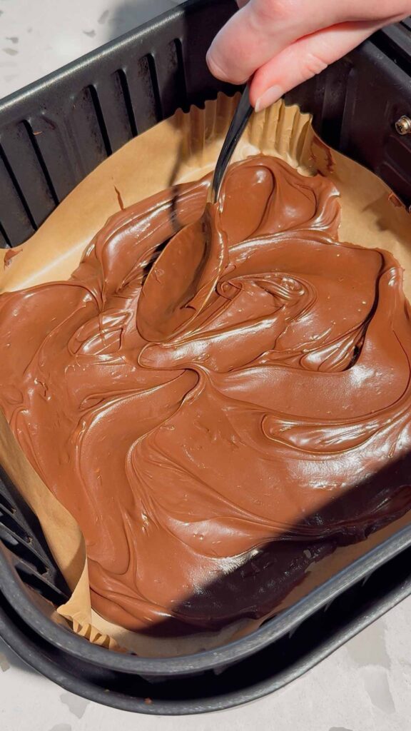 Nutella spread in the bottom of an air fryer liner