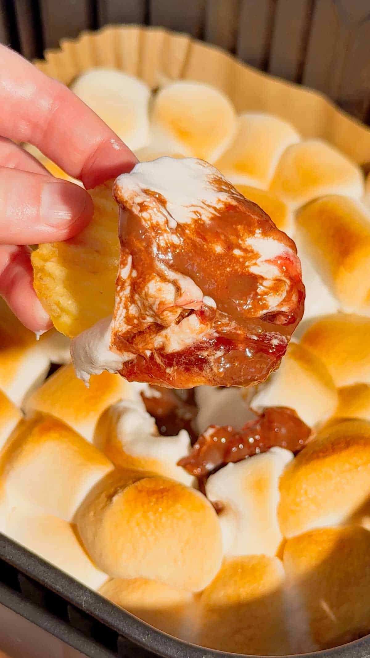 This Air Fryer Strawberry Nutella S’mores Dip is the ultimate easy dessert recipe for chocolate lovers, summer parties and cozy movie nights at home. Made with creamy Nutella, sweet strawberry pie filling and gooey toasted marshmallows, this air fryer dessert is a fun twist on classic campfire s’mores without needing a fire pit. Serve it warm with graham crackers, cookies, pretzels or fresh strawberries for the perfect sweet snack, party dessert or quick treat idea. If you love easy air fryer recipes, dessert dips, viral TikTok desserts, chocolate strawberry desserts, marshmallow treats and fun family dessert ideas, this easy s’mores dip recipe is a must try for sleepovers, date nights, birthday parties, holiday gatherings and summer entertaining.