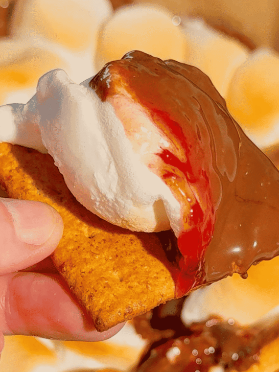 This Air Fryer Strawberry Nutella S’mores Dip is the ultimate easy dessert recipe for chocolate lovers, summer parties and cozy movie nights at home. Made with creamy Nutella, sweet strawberry pie filling and gooey toasted marshmallows, this air fryer dessert is a fun twist on classic campfire s’mores without needing a fire pit. Serve it warm with graham crackers, cookies, pretzels or fresh strawberries for the perfect sweet snack, party dessert or quick treat idea. If you love easy air fryer recipes, dessert dips, viral TikTok desserts, chocolate strawberry desserts, marshmallow treats and fun family dessert ideas, this easy s’mores dip recipe is a must try for sleepovers, date nights, birthday parties, holiday gatherings and summer entertaining.