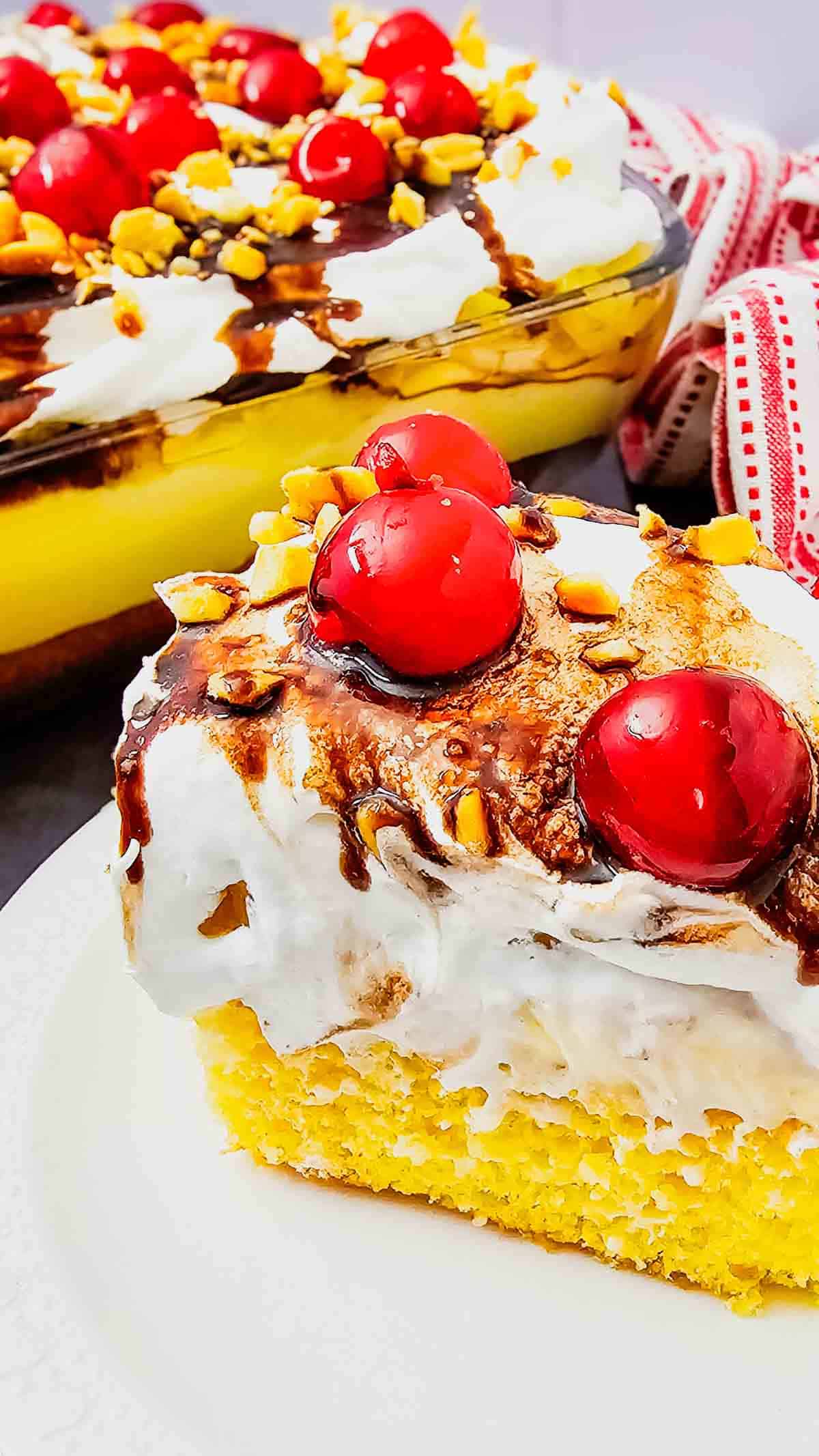 Banana Split Cake is the ultimate easy dessert recipe for anyone who loves classic banana split flavors in a soft baked cake. This layered dessert starts with a moist yellow cake base and is topped with bananas, crushed pineapple, fluffy whipped topping, chocolate drizzle, and maraschino cherries for the perfect sweet finish. If you’re searching for easy cake recipes, banana desserts, pineapple desserts, potluck desserts, summer desserts, or crowd pleasing party desserts, this Banana Split Cake recipe is a must-try. Great for birthdays, BBQs, family gatherings, holidays, and make ahead desserts, this colorful treat is simple to prepare and always a hit with both kids and adults who love fun retro dessert recipes.