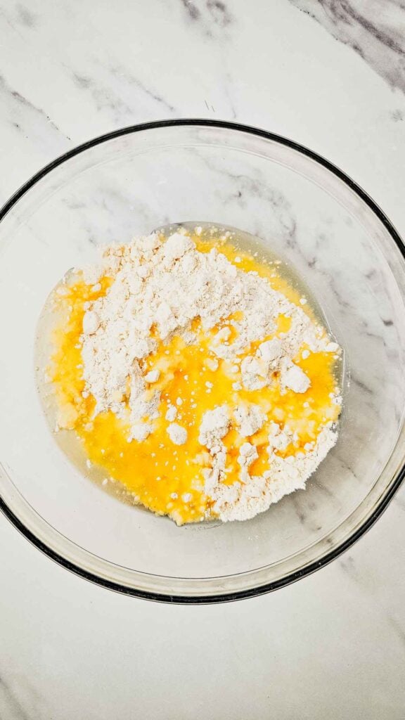 cake mix and pineapple juice in a mixing bowl