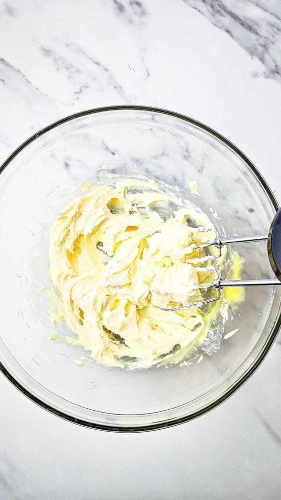cream cheese and pudding mixture in a mixing bowl
