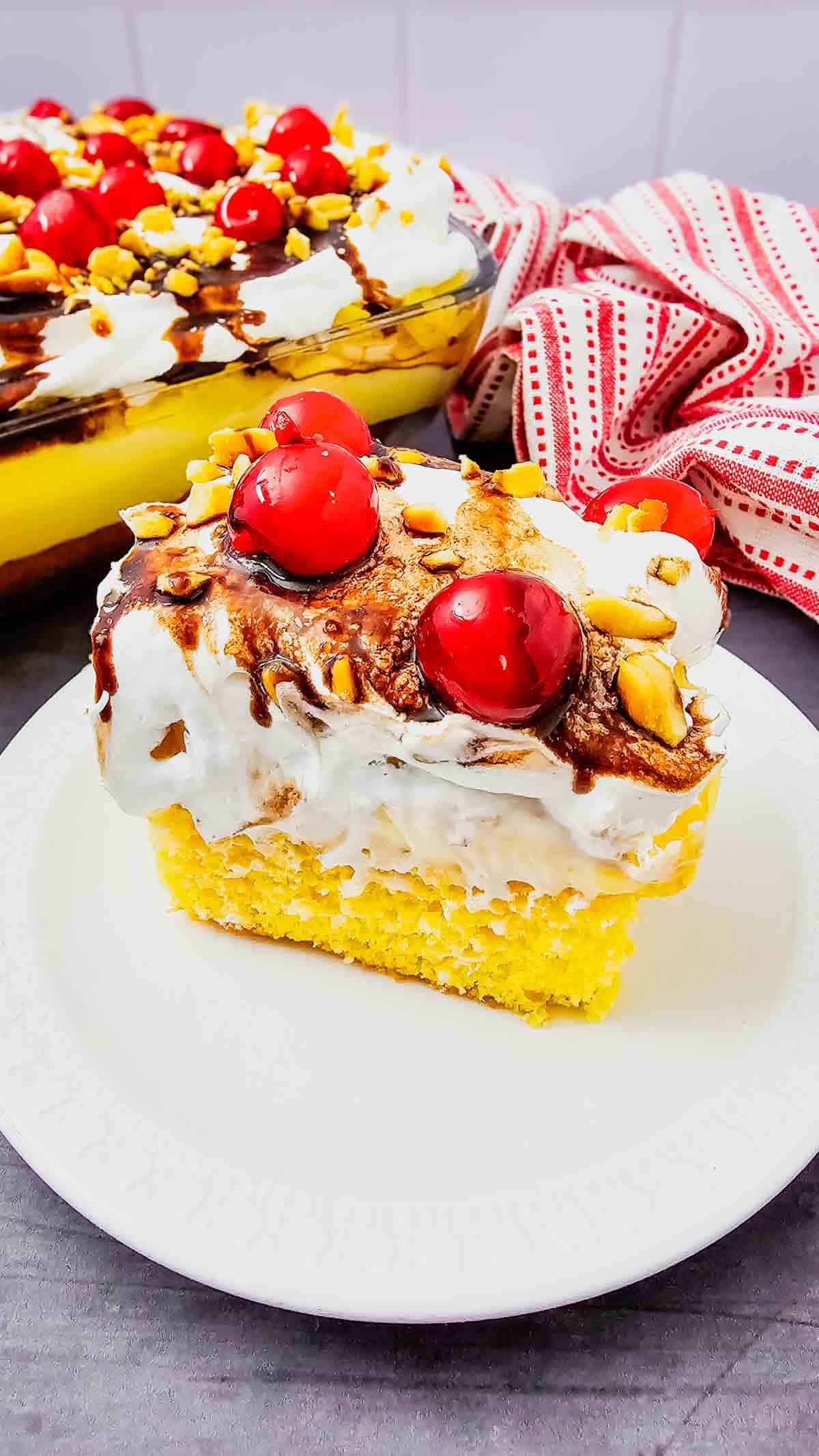 Banana Split Cake is the ultimate easy dessert recipe for anyone who loves classic banana split flavors in a soft baked cake. This layered dessert starts with a moist yellow cake base and is topped with bananas, crushed pineapple, fluffy whipped topping, chocolate drizzle, and maraschino cherries for the perfect sweet finish. If you’re searching for easy cake recipes, banana desserts, pineapple desserts, potluck desserts, summer desserts, or crowd pleasing party desserts, this Banana Split Cake recipe is a must-try. Great for birthdays, BBQs, family gatherings, holidays, and make ahead desserts, this colorful treat is simple to prepare and always a hit with both kids and adults who love fun retro dessert recipes.