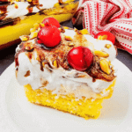 Banana Split Cake is the ultimate easy dessert recipe for anyone who loves classic banana split flavors in a soft baked cake. This layered dessert starts with a moist yellow cake base and is topped with bananas, crushed pineapple, fluffy whipped topping, chocolate drizzle, and maraschino cherries for the perfect sweet finish. If you’re searching for easy cake recipes, banana desserts, pineapple desserts, potluck desserts, summer desserts, or crowd pleasing party desserts, this Banana Split Cake recipe is a must-try. Great for birthdays, BBQs, family gatherings, holidays, and make ahead desserts, this colorful treat is simple to prepare and always a hit with both kids and adults who love fun retro dessert recipes.