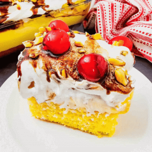 Banana Split Cake is the ultimate easy dessert recipe for anyone who loves classic banana split flavors in a soft baked cake. This layered dessert starts with a moist yellow cake base and is topped with bananas, crushed pineapple, fluffy whipped topping, chocolate drizzle, and maraschino cherries for the perfect sweet finish. If you&rsquo;re searching for easy cake recipes, banana desserts, pineapple desserts, potluck desserts, summer desserts, or crowd pleasing party desserts, this Banana Split Cake recipe is a must-try. Great for birthdays, BBQs, family gatherings, holidays, and make ahead desserts, this colorful treat is simple to prepare and always a hit with both kids and adults who love fun retro dessert recipes.