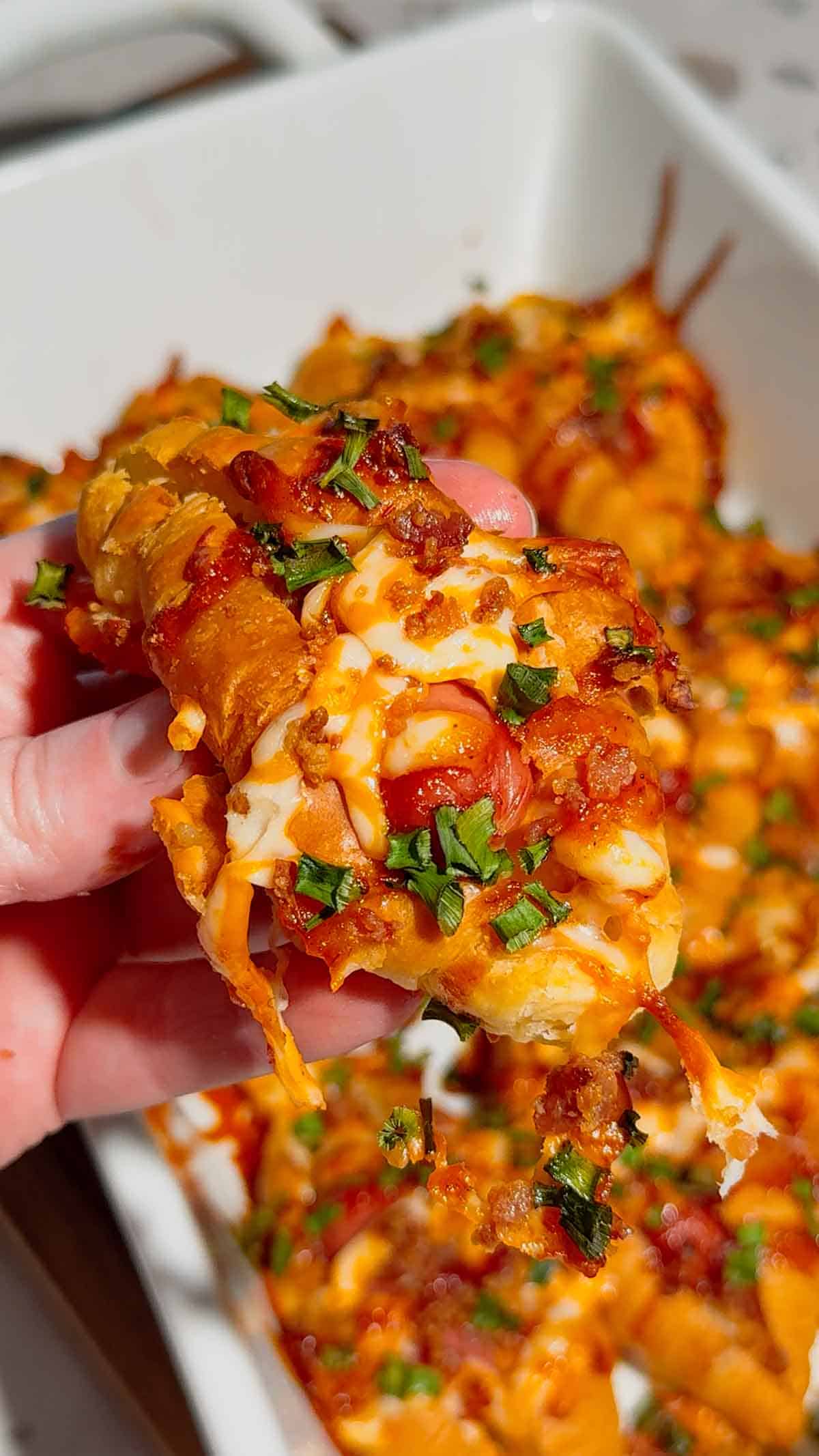 Looking for the ultimate easy party appetizer? These Cheesy Bacon Mini Croissant Dogs are loaded with smoky bacon, melty cheddar cheese, cocktail wieners and BBQ sauce baked inside buttery mini croissants for the perfect bite-sized snack. This easy appetizer recipe is perfect for game day food, football parties, holiday appetizers, movie night snacks and fun family dinners. Using store bought mini croissants keeps this recipe quick, simple and packed with comfort food flavor. If you love pigs in a blanket, cheesy hot dog recipes, bacon appetizers, easy finger foods and crowd pleasing party snacks, these loaded mini croissant dogs are a must-try recipe everyone will be grabbing straight from the pan for seconds.