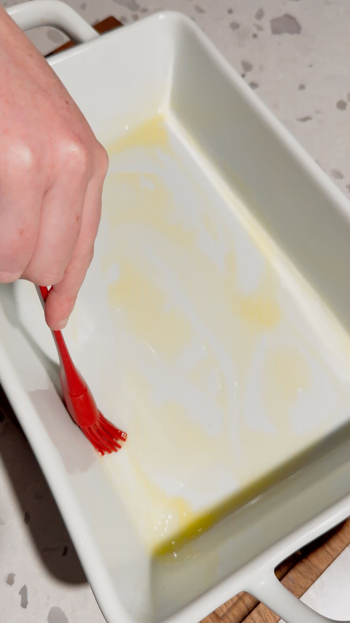 brush a baking dish with butter
