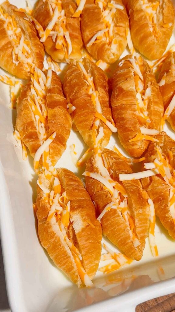 shredded cheddar cheese stuffed inside mini croissants