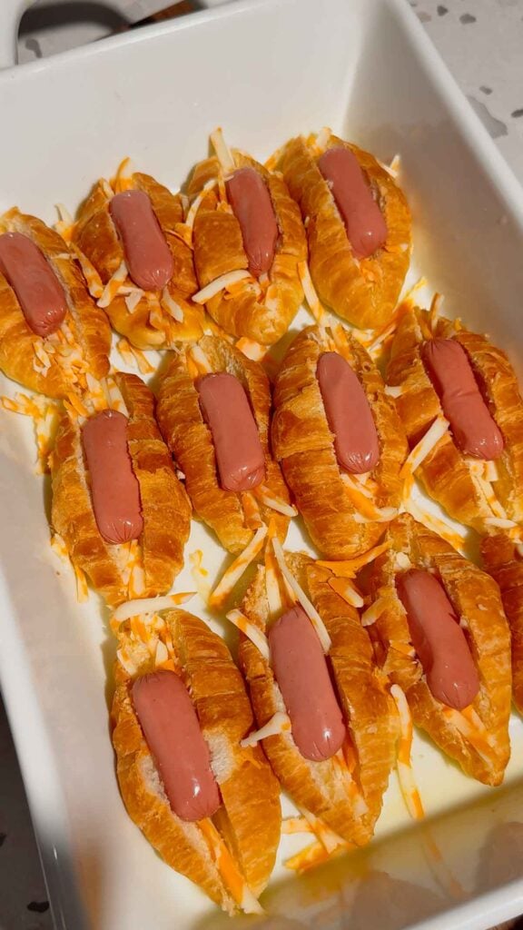 cocktail wieners stuffed inside mini croissants in a baking dish