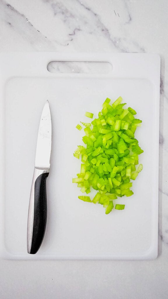 diced celery on a cutting board
