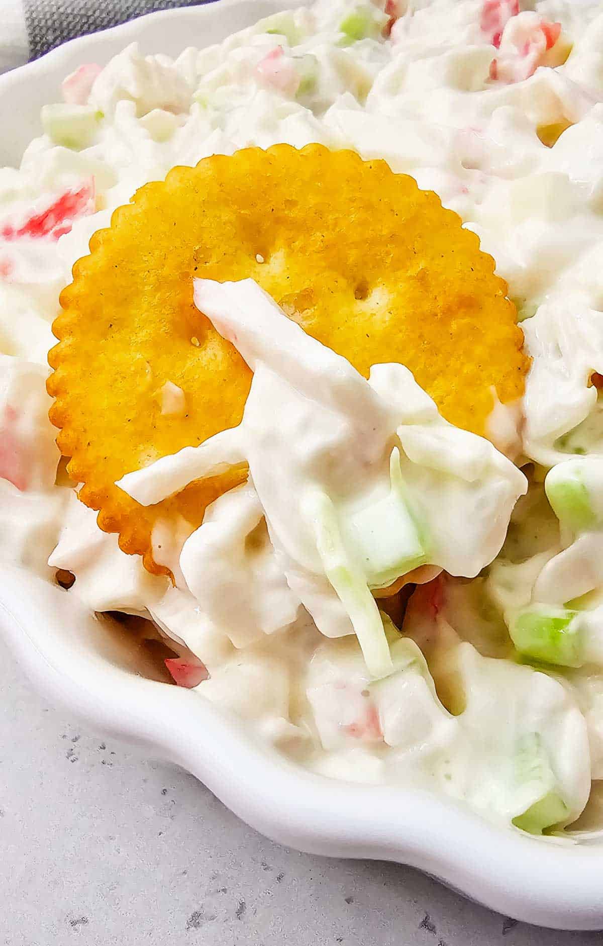 Cold Crab Salad is the easy chilled seafood recipe you’ll want to make all summer long. This creamy crab salad is loaded with imitation crab, crunchy celery, onions and a flavorful dressing for the perfect light lunch, party appetizer or quick dinner idea. Serve it with crackers, pile it onto sandwich rolls, stuff it into croissants or enjoy it straight from the bowl for an easy no cook meal. This cold crab salad recipe is perfect for potlucks, picnics, BBQs, beach lunches and meal prep because it comes together fast with simple ingredients. If you love easy seafood salad recipes, crab salad sandwiches, cold lunch ideas and refreshing summer recipes, this creamy imitation crab salad is guaranteed to become a family favorite.
