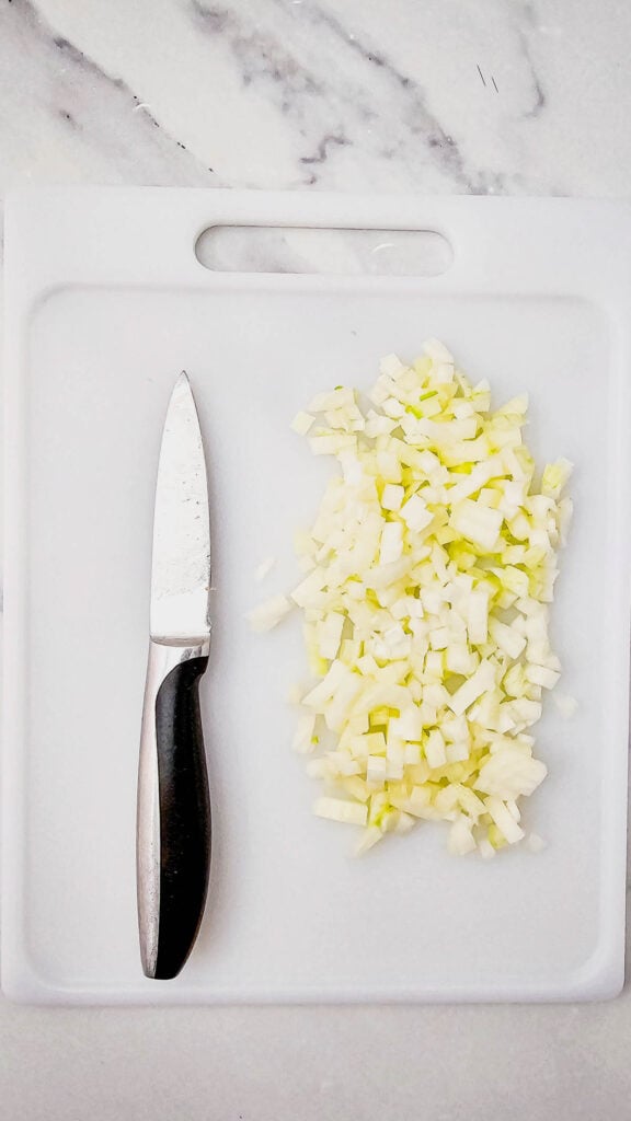 diced onion on a cutting board