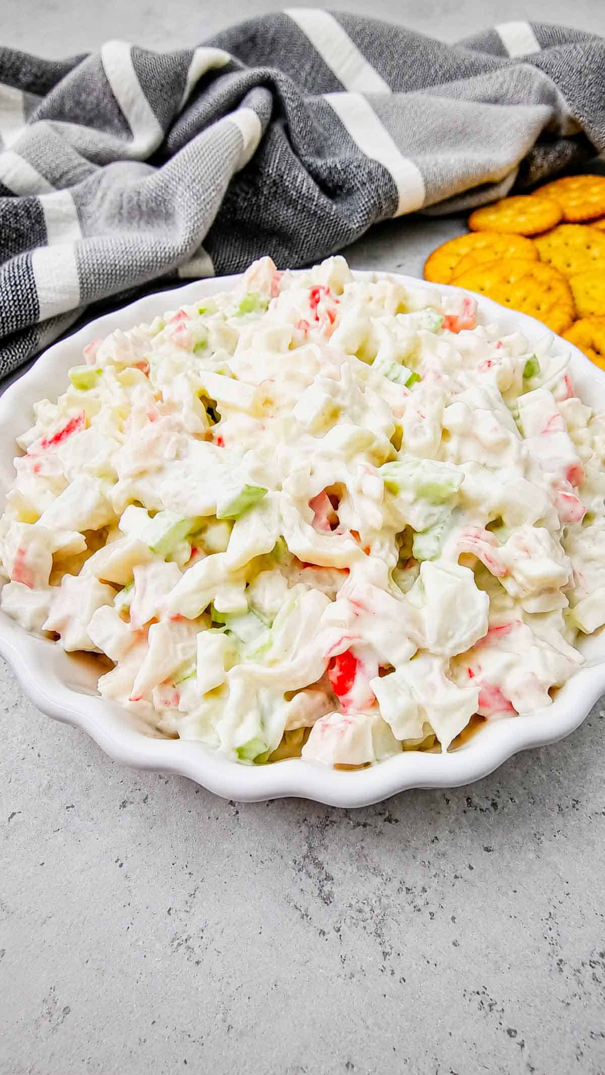 Cold Crab Salad is the easy chilled seafood recipe you’ll want to make all summer long. This creamy crab salad is loaded with imitation crab, crunchy celery, onions and a flavorful dressing for the perfect light lunch, party appetizer or quick dinner idea. Serve it with crackers, pile it onto sandwich rolls, stuff it into croissants or enjoy it straight from the bowl for an easy no cook meal. This cold crab salad recipe is perfect for potlucks, picnics, BBQs, beach lunches and meal prep because it comes together fast with simple ingredients. If you love easy seafood salad recipes, crab salad sandwiches, cold lunch ideas and refreshing summer recipes, this creamy imitation crab salad is guaranteed to become a family favorite.